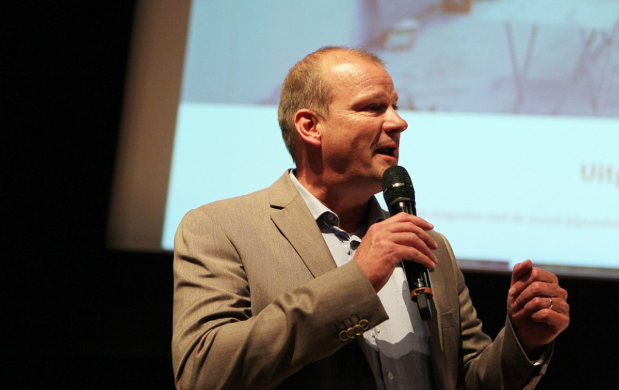 A man speaking at an event
